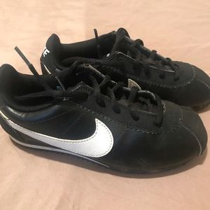 Children black and white Nike sneakers